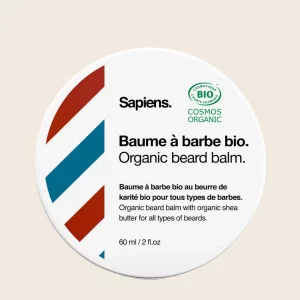 baume à barbe bio Sapiens Wild Forest, avec texture fondante, sur fond bois naturel. Produit 100 % bio et fabriqué en France.
